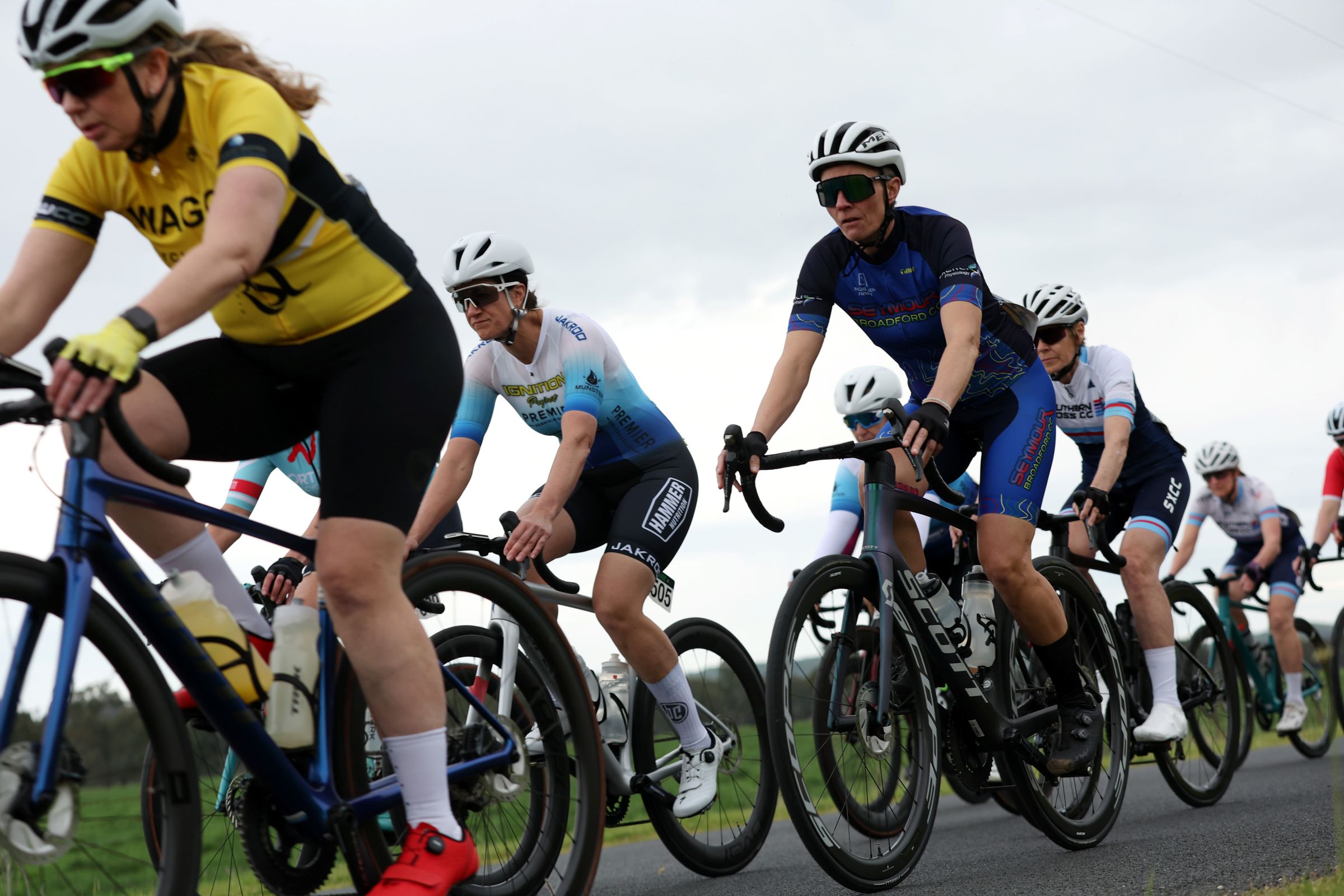 A close-up of women road racers in a peloton during an AusCycling Masters road race